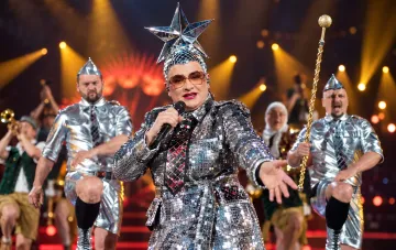 Verka Serduchka performs on stage wearing a glittering outfit and the famous eight-kilogram star on her head.