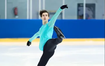 Figure skater Kyrylo Marsak performs a routine on the ice